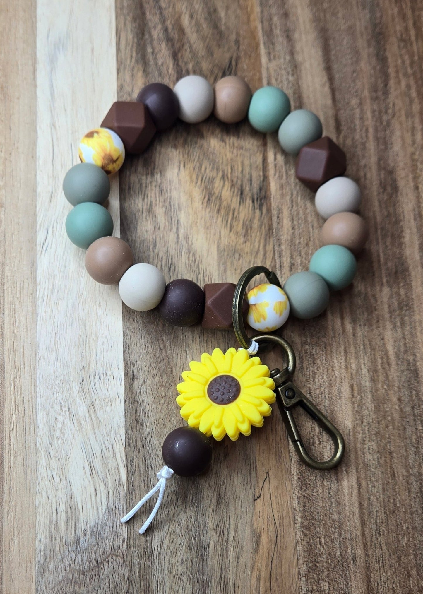 Brown/Greens with Yellow Daisy Charm Wristlet