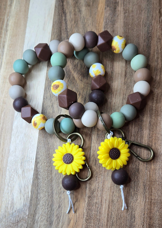Brown/Greens with Yellow Daisy Charm Wristlet