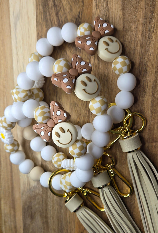 Brown Bows and Yellow Smiles Wristlet with Tan Tassel